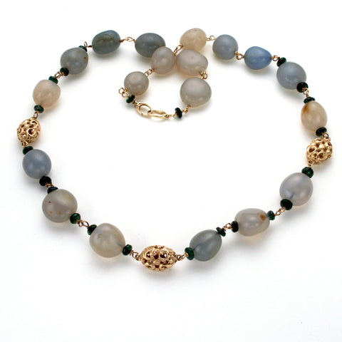 Classic necklace with smooth oval greenish blue stones, small faceted green tourmaline and hand carved gold oval beads