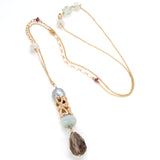 Sculptural gold bead featuring hearts, gray pearl, smokey quartz, and milky aquamarine on delicate chain with tiny accent stones
