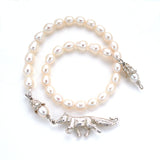 hand carved by anna biggs in wilmington delawarefox clasp, fresh water pearl