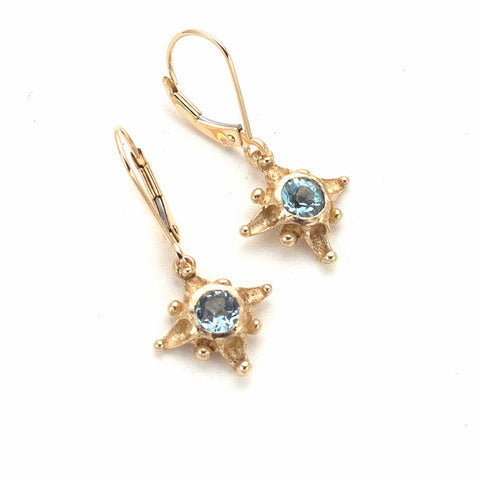 Tiny 14 karat gold star drop earrings with Sky blue topaz center