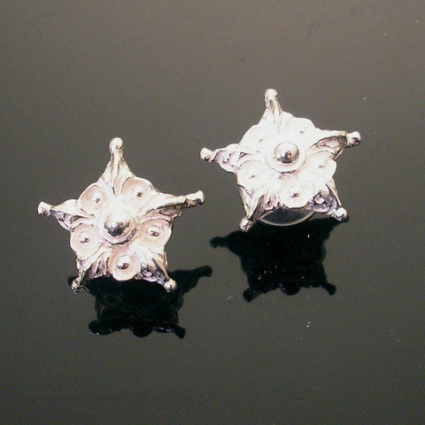 Hand sculpted sterling silver post earring with floral star motif