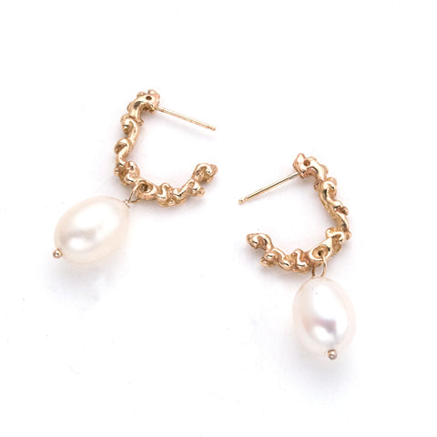 half hoop earrings in textured gold with white pearl drop