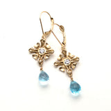 Handmade Gold lever-back earrings, sculpted square design accented with diamonds, faceted sky blue topaz drop