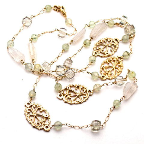 Elegant 36 inch gold necklace, hand-carved open filigree ovals scattered between Serpentine, moonstone, green amethyst